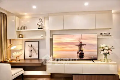 Luxurious living room with modern decor and large TV, perfect for relaxation and entertainment.