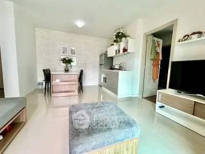 Modern open-plan living room with sleek kitchen and dining area