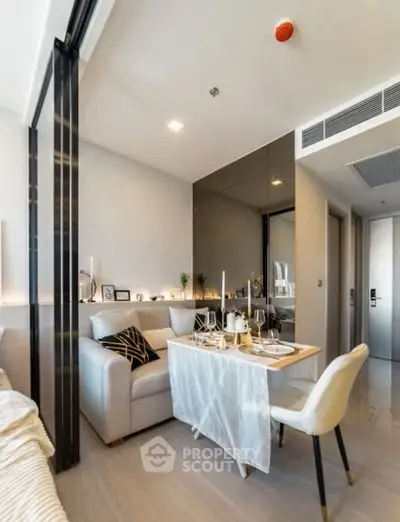 Modern living room with elegant dining setup and cozy seating area