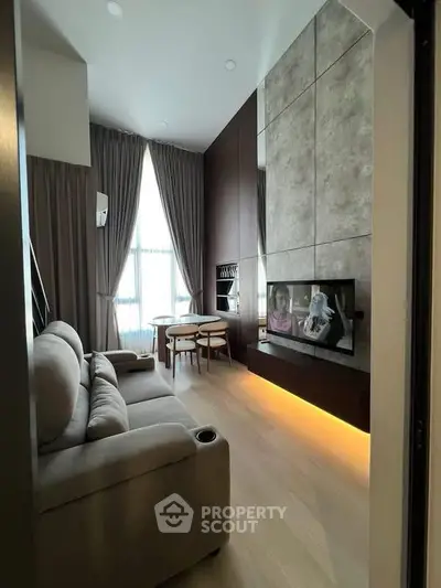 Modern living room with high ceiling, cozy sofa, and stylish dining area.