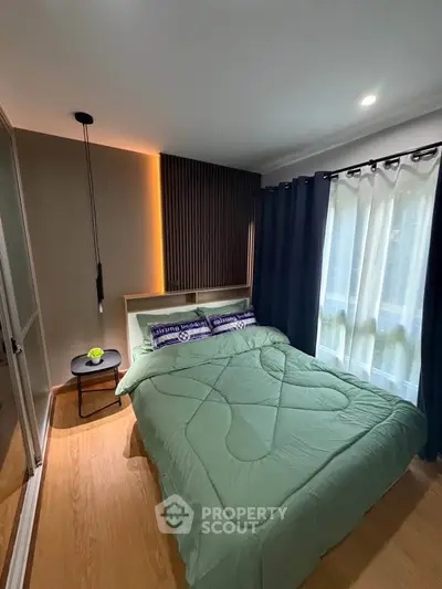 Cozy bedroom with modern decor and natural light, featuring a stylish bed and elegant curtains.