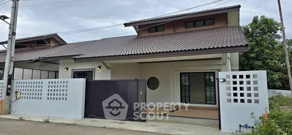 Charming single-story house with modern design and spacious driveway