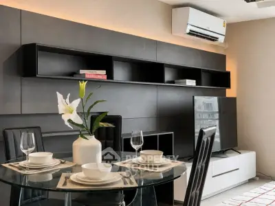 Modern living room with sleek furniture and dining setup, featuring a wall-mounted air conditioner and stylish decor.