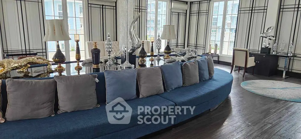 Luxurious living room with elegant decor and large windows for natural light