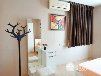 Modern bedroom with stylish decor and air conditioning unit