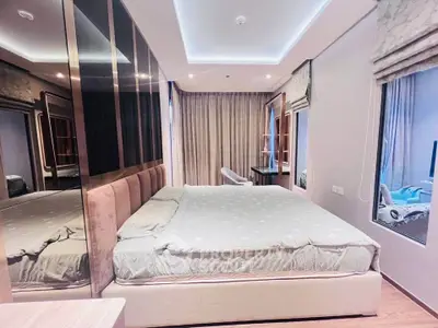 Luxurious bedroom with modern design and elegant lighting