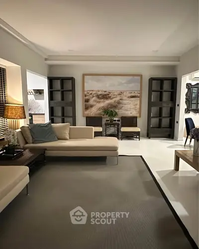 Elegant living room with modern decor and cozy seating area, perfect for relaxation and entertaining.