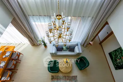 Luxurious living room with elegant chandelier and modern decor