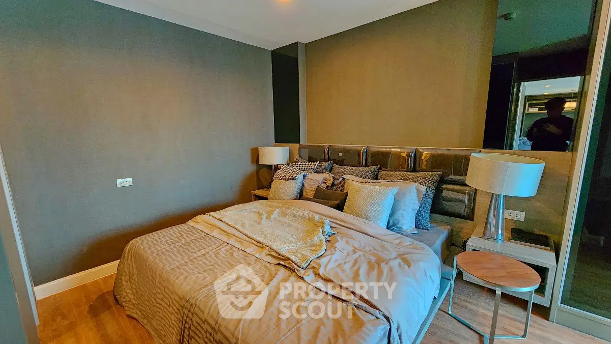 Cozy modern bedroom with stylish decor and warm lighting