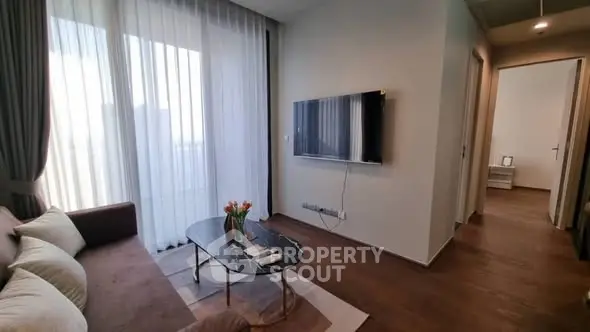 Modern living room with wall-mounted TV and elegant decor