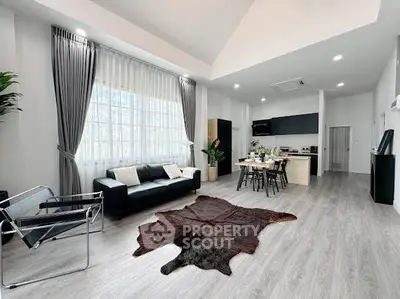 Spacious modern living room with high ceilings and stylish decor