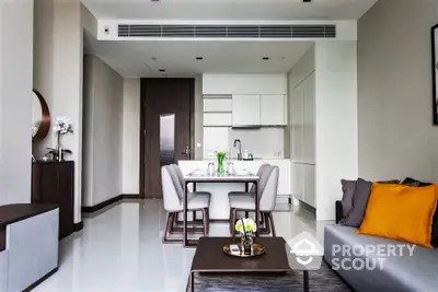 Modern living room with dining area and sleek kitchen in open layout