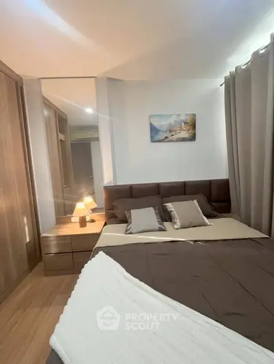 Cozy bedroom with modern decor and warm lighting