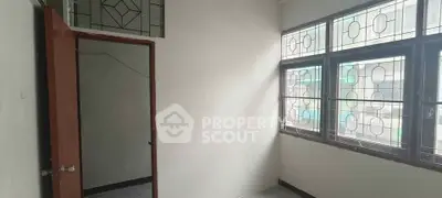 Bright room with large windows and decorative glass panels, ideal for customization.