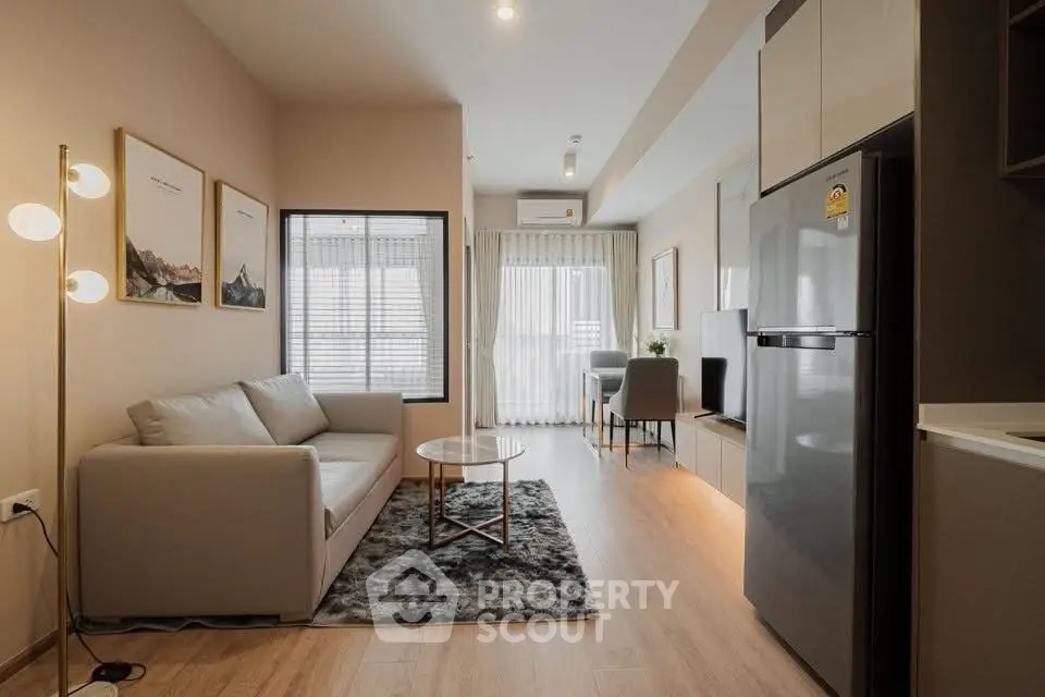 Modern living room with sleek design and natural light, featuring a cozy sofa and stylish decor.