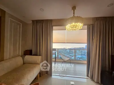 Luxurious living room with stunning ocean view and elegant chandelier