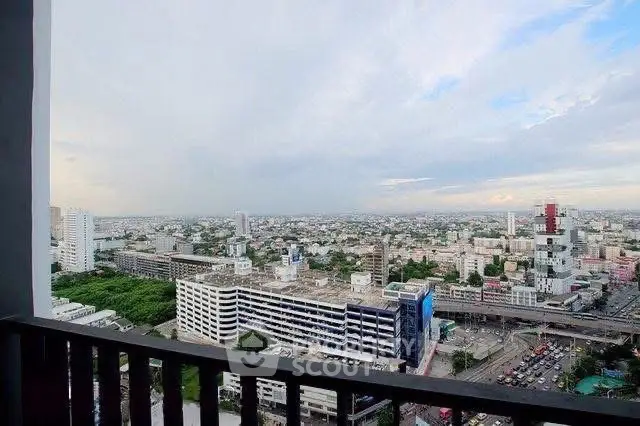 Stunning cityscape view from a high-rise balcony, showcasing urban skyline and expansive horizon.