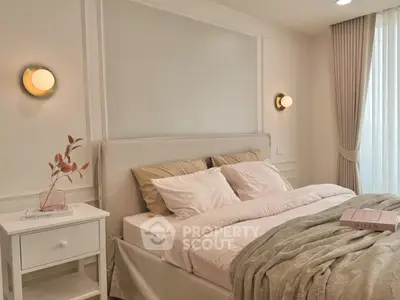 Elegant bedroom with cozy bedding and soft lighting, perfect for relaxation.