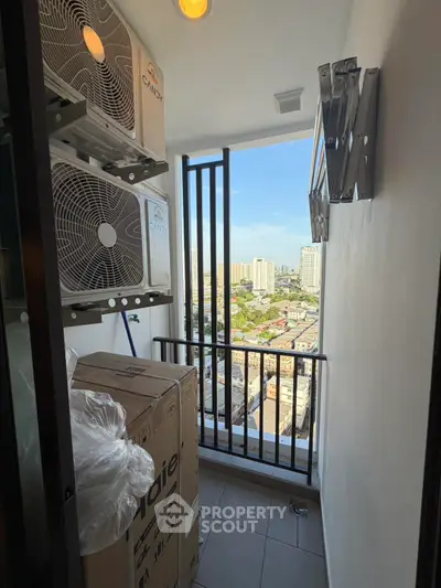 High-rise balcony with city view and air conditioning units, perfect for urban living.