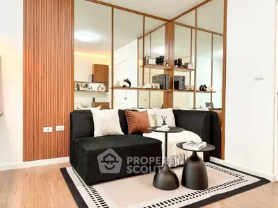 Modern living room with stylish black sofa and decorative mirrors