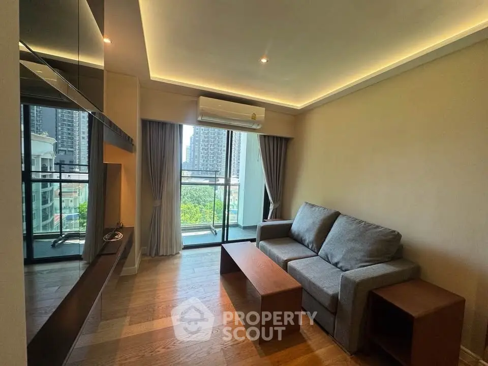 Modern living room with sleek design and city view, featuring a cozy sofa and elegant lighting.