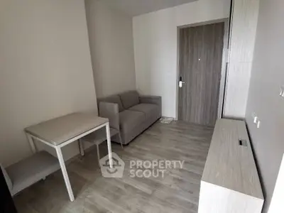 Modern minimalist living room with sleek furniture and wooden flooring