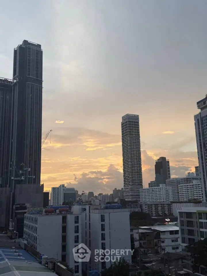 Stunning urban skyline view with modern skyscrapers at sunset, perfect for city living enthusiasts.