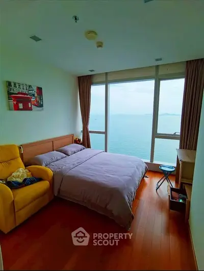 Stunning bedroom with ocean view and cozy furnishings