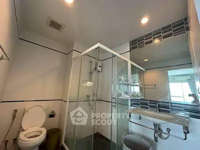 Modern bathroom with glass shower and sleek fixtures