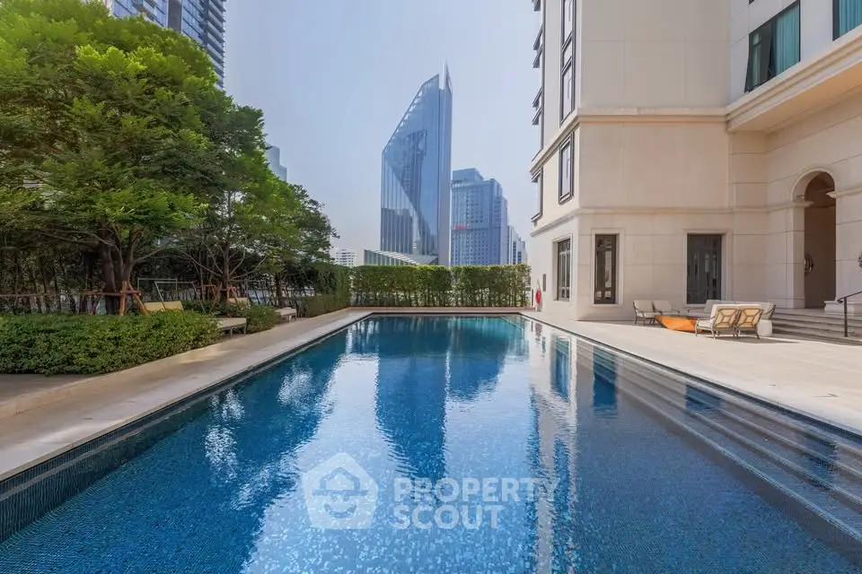 Luxurious residential building with stunning pool and cityscape view