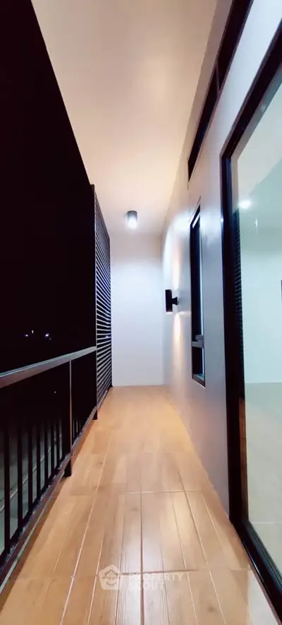 Spacious modern balcony with sleek design and wooden flooring