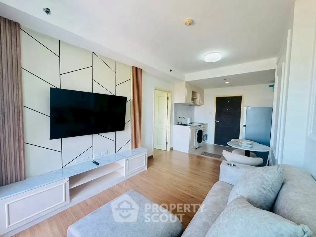 Modern living room with stylish TV wall and cozy furniture