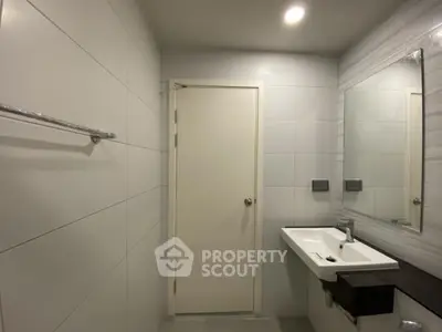 Modern bathroom with sleek design and large mirror