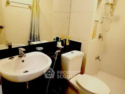 Modern bathroom with sleek fixtures and shower area