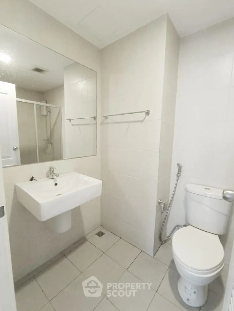 Modern bathroom with sleek white fixtures and minimalist design