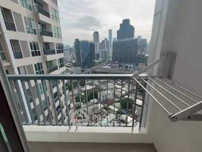 High-rise balcony with stunning cityscape view, perfect for urban living enthusiasts.