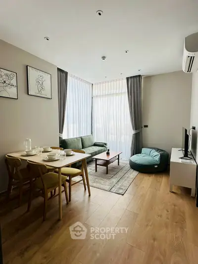 Stylish modern living room with elegant decor and natural light, perfect for urban living.