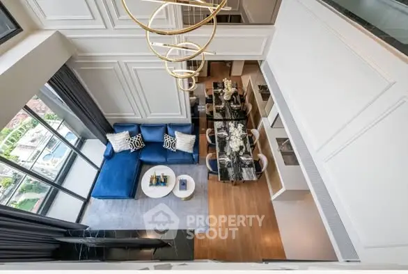 Luxurious modern living room with high ceiling and elegant decor