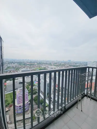 Stunning high-rise balcony with panoramic city view, perfect for urban living enthusiasts.