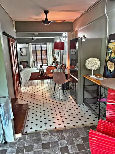 Charming open-layout living room with stylish decor and unique flooring