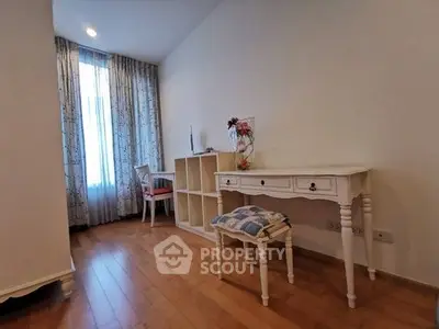Charming study room with elegant wooden flooring and classic furniture