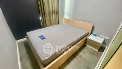 Cozy bedroom with modern bed and nightstand in a stylish apartment