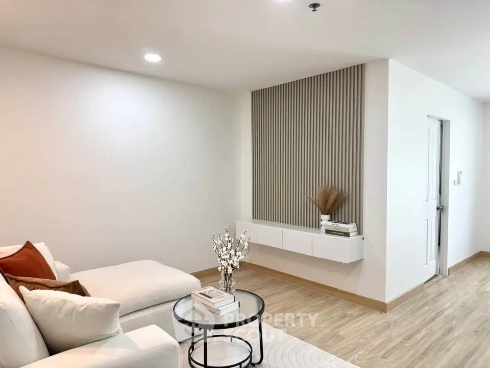 Modern living room with elegant decor and cozy seating area