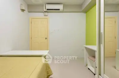 Minimalist bedroom with air conditioning and mirrored wardrobe