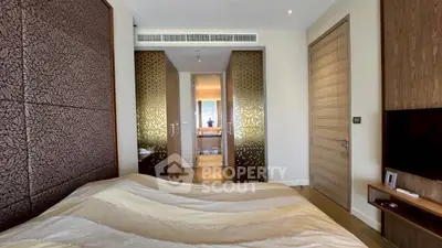 Luxurious bedroom with elegant decor and modern amenities in a high-end apartment.