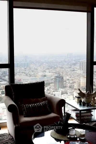 Luxurious living room with panoramic city view from high-rise apartment