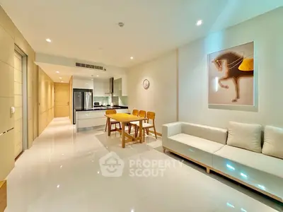 Modern open-plan living room with sleek kitchen and stylish decor