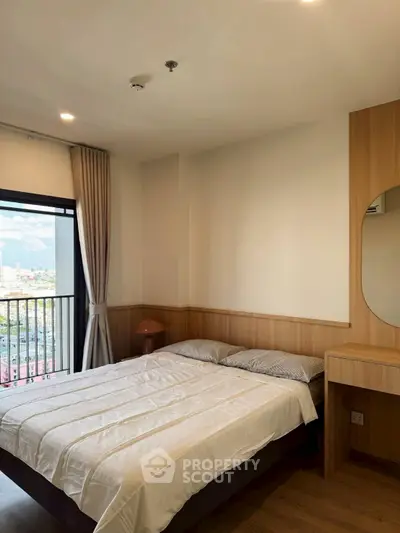 Cozy bedroom with city view, featuring a comfortable bed and stylish wooden decor.