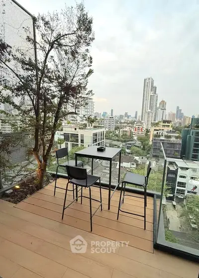 Stunning balcony with city skyline view and modern outdoor seating.