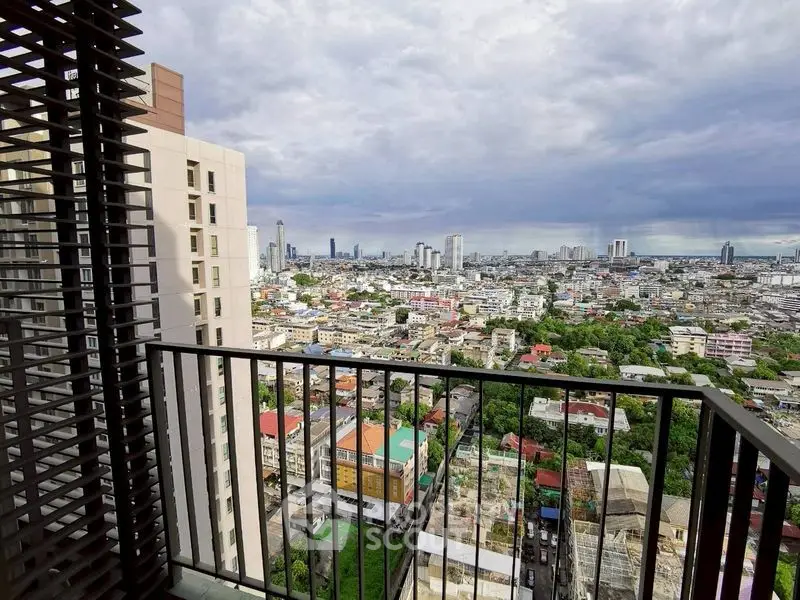 Stunning cityscape view from high-rise balcony with expansive skyline and urban landscape.